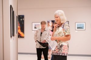 woman looking at art